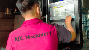 Thực hiện reset hệ thống điều khiển CNC để khắc phục lỗi trục X